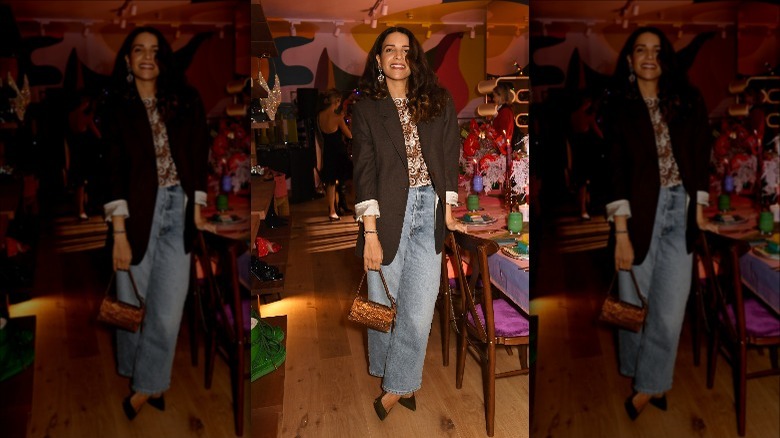 Designer Racil Chalhoub in oversized blazer and jeans at Christmas party