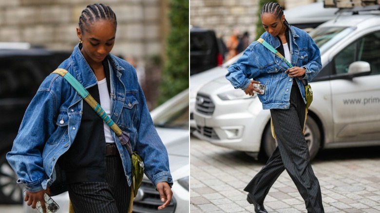 Woman wearing denim jacket, black jacket and white t-shirt