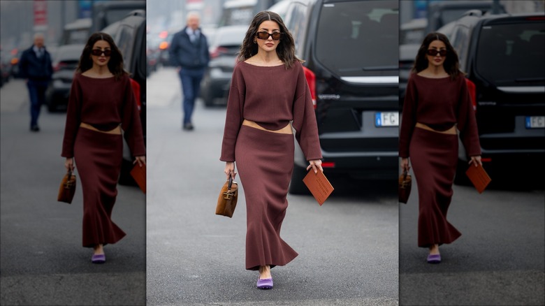 Woman in brown skirt and purple ballet flats