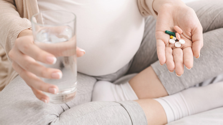 pregnant woman taking vitamins