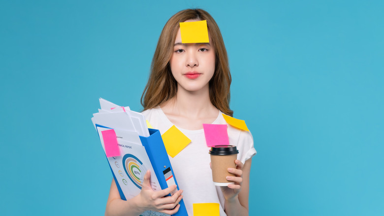 Woman covered in sticky notes