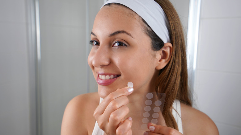 Woman treating acne