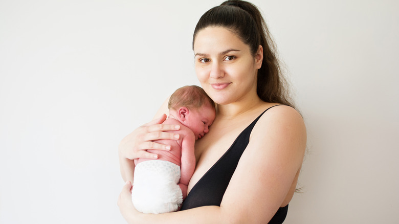 Smiling mother with newborn