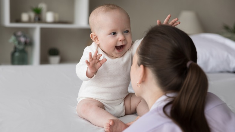 Mom and laughing baby