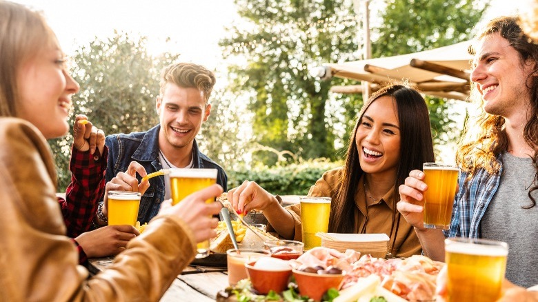 A group of friends eating and drinking