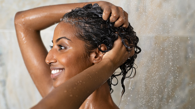 Brown woman washing her hair