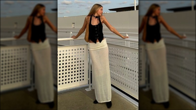 fashion blogger posing on a parking roof