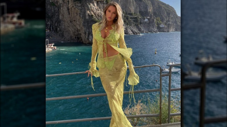 woman modeling sheer green beach cover-up