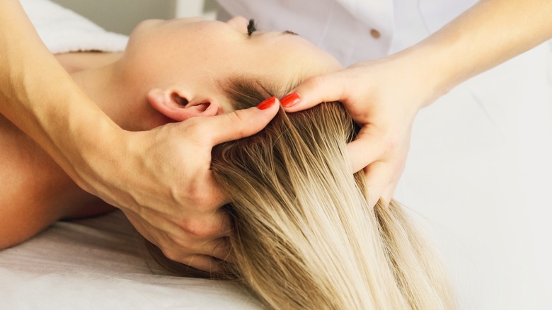 Woman enjoying scalp massage