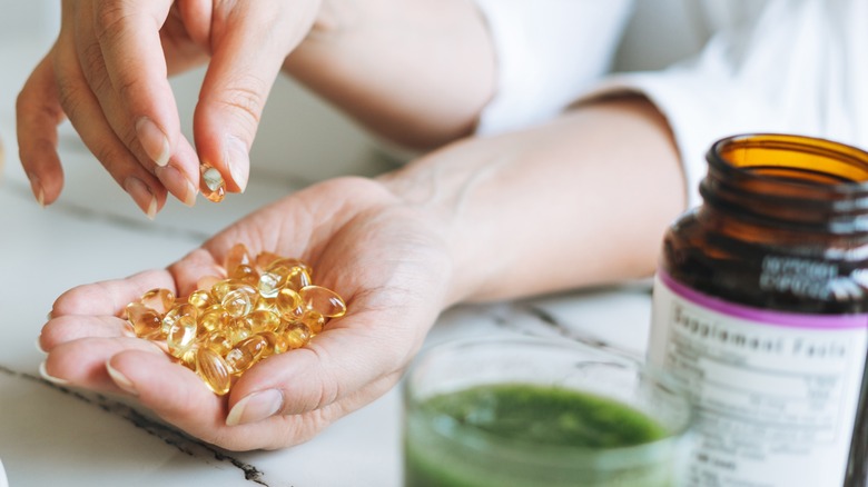 A woman taking supplements