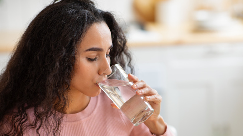 Woman drinking glass of water