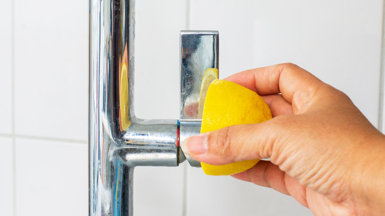 Woman cleaning with a lemon