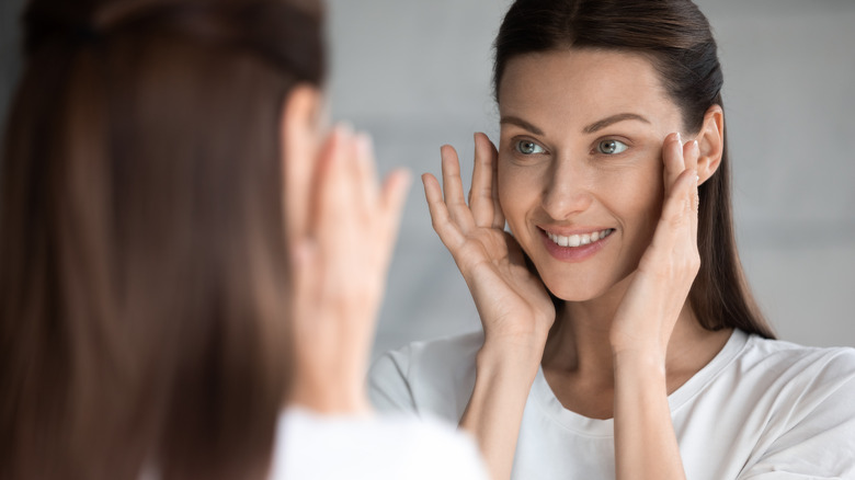 A woman smiling in mirror