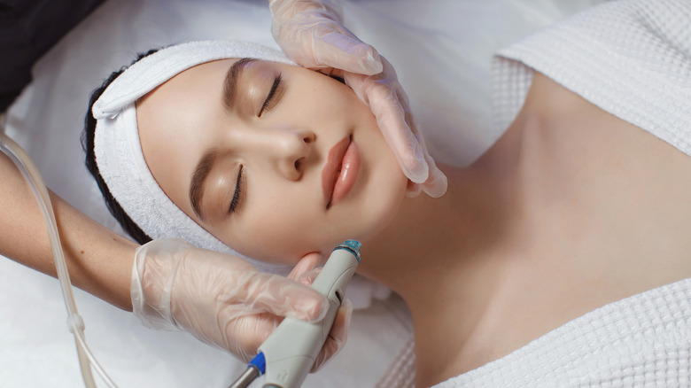 A woman getting a facial treatment