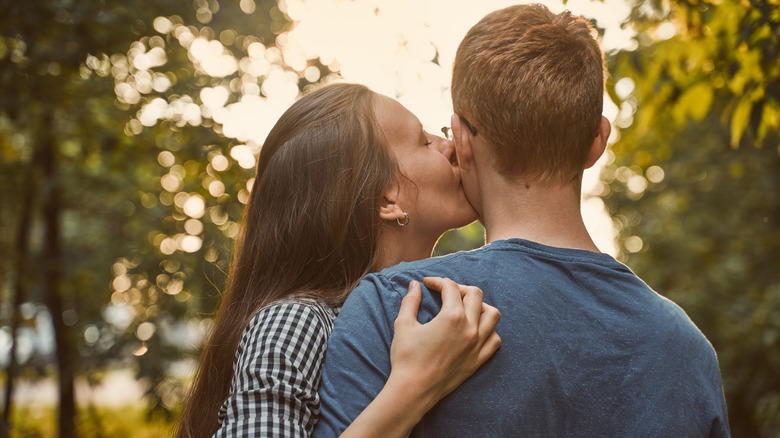 girlfriend kissing boyfriend