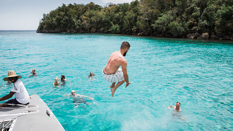 Man diving off boat