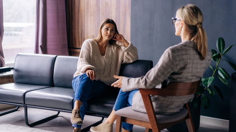 Woman speaking to a therapist