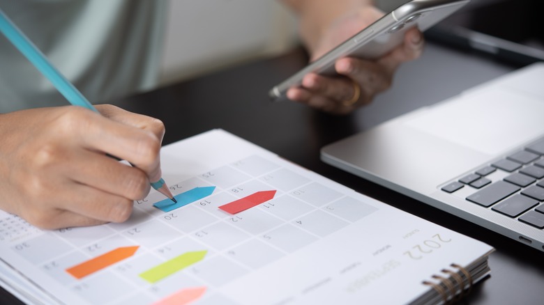 Woman looking at calendar