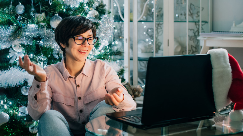 woman talking to friends online at christmas