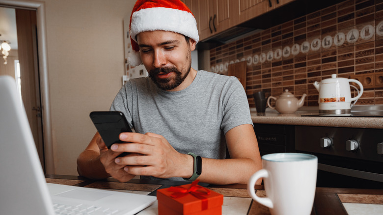 man celebrating Christmas online