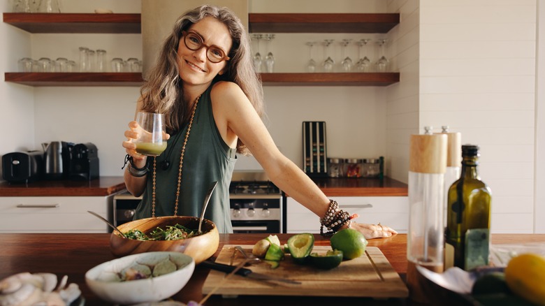 woman in kitchen with vegetables