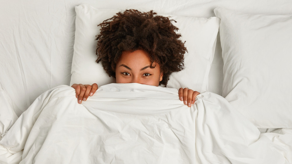 Sleeping on a silk pillowcase will help your hair avoid dryness