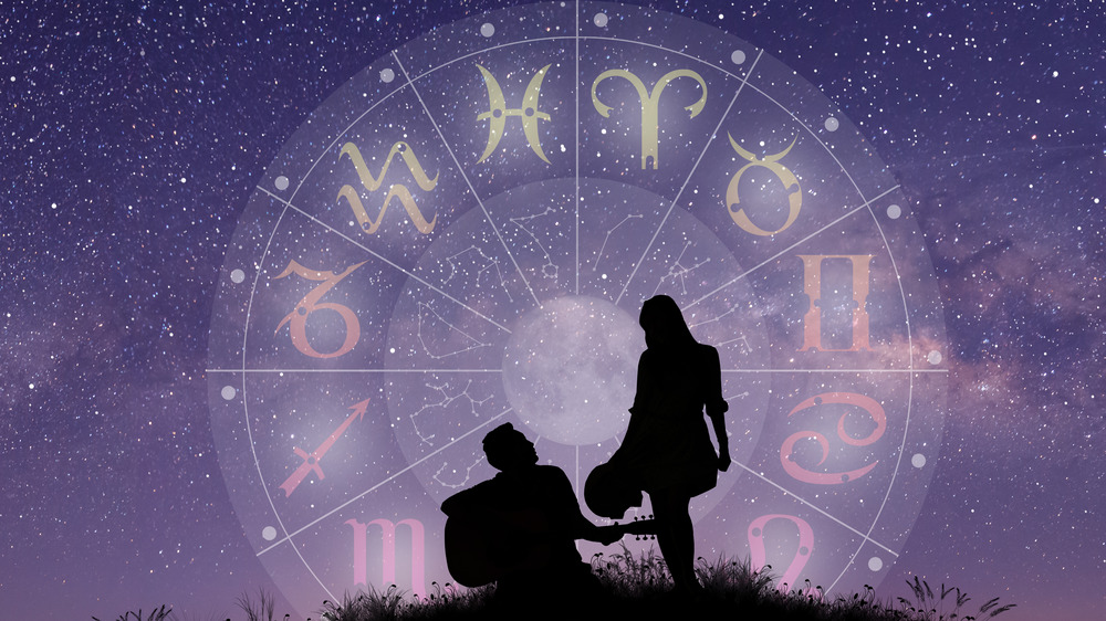 Couple silhouette in birth chart, stars background