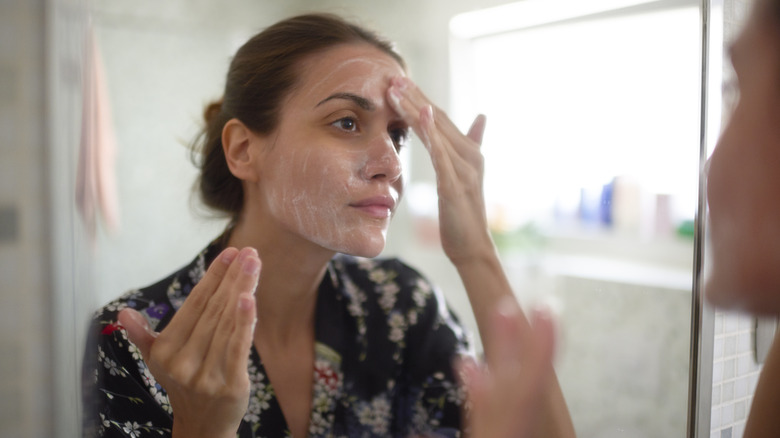 Woman washing her face