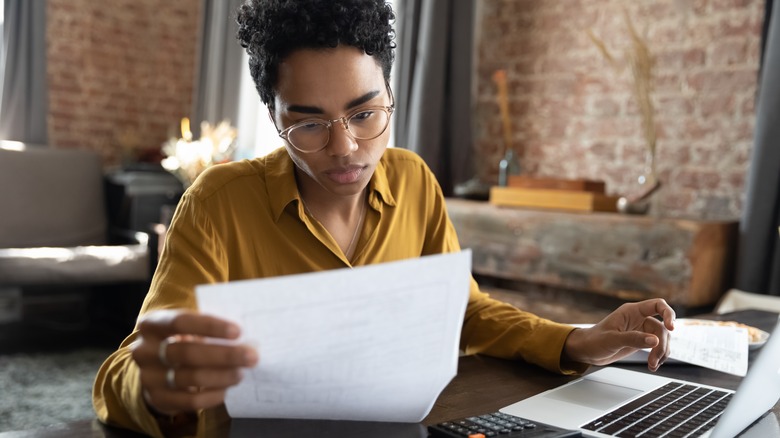 A woman working at her desk. 