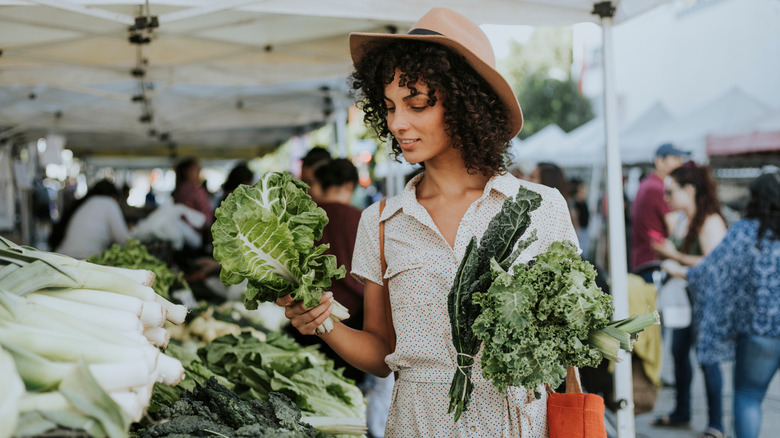 Woman buying vegetables