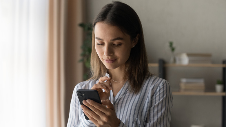 woman looking at phone