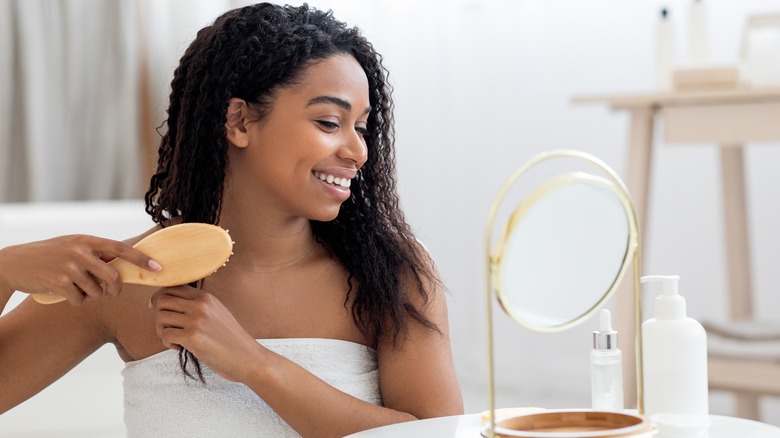 Woman combing her hair