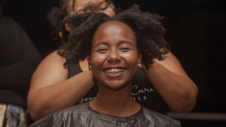 Woman getting hair done