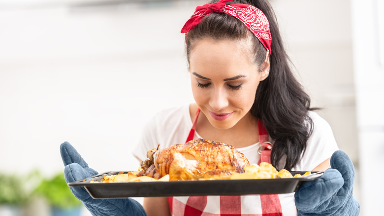 Woman smelling chicken