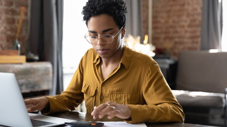 Woman calculating her income