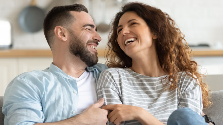 young couple sitting together