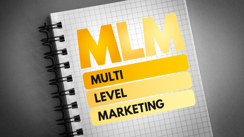 Notebook reading "multi level marketing"