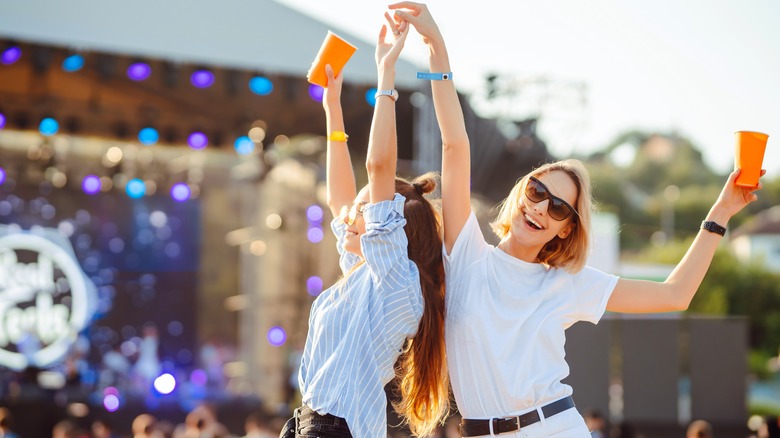 friends dancing at a concert