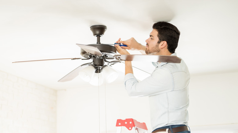 Man installing a ceiling fan