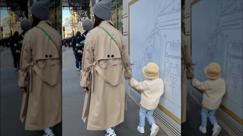 A woman and child walking