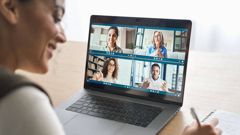 Woman on a virtual meeting call via laptop