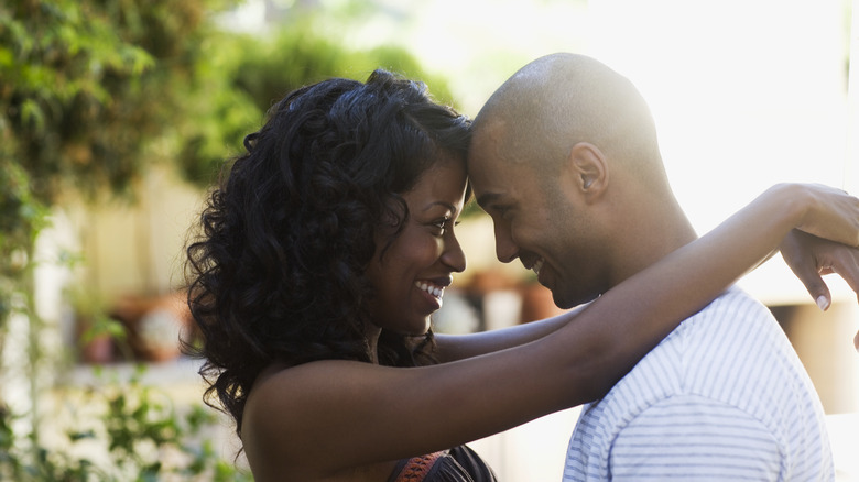 Couple smiling and embracing