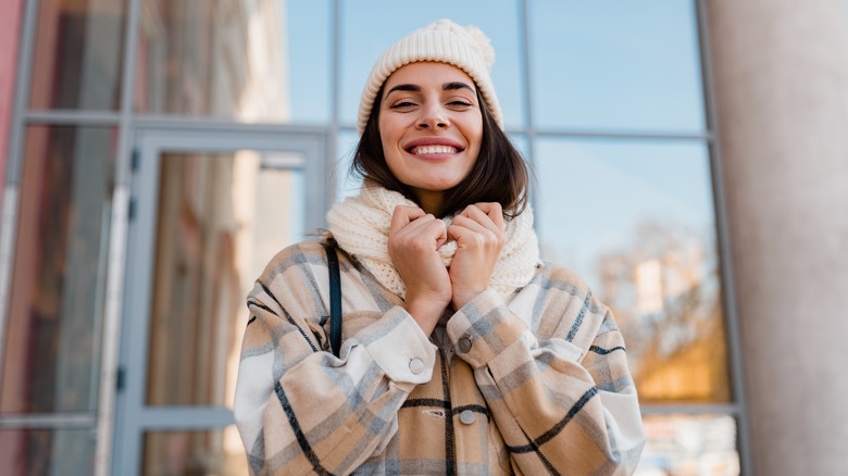 Woman in winter wear smiling