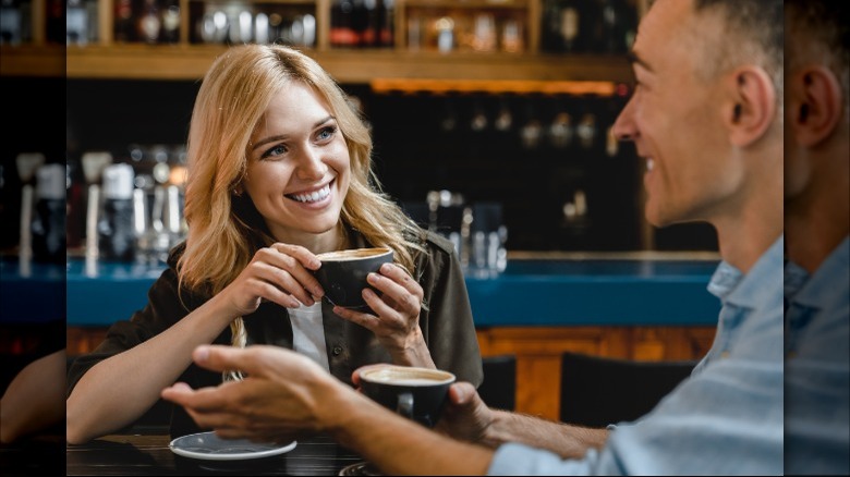 Couple talking over coffee