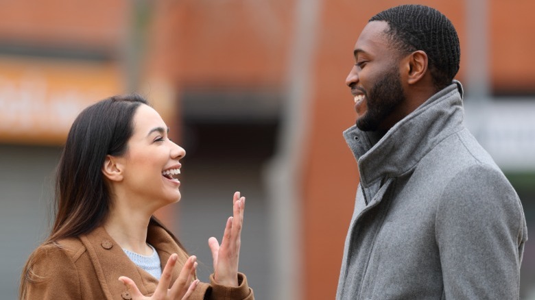 Couple talking outside