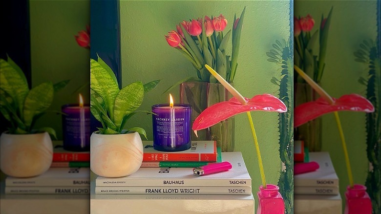 candle with books and flowers