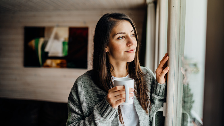 Girl looking out window