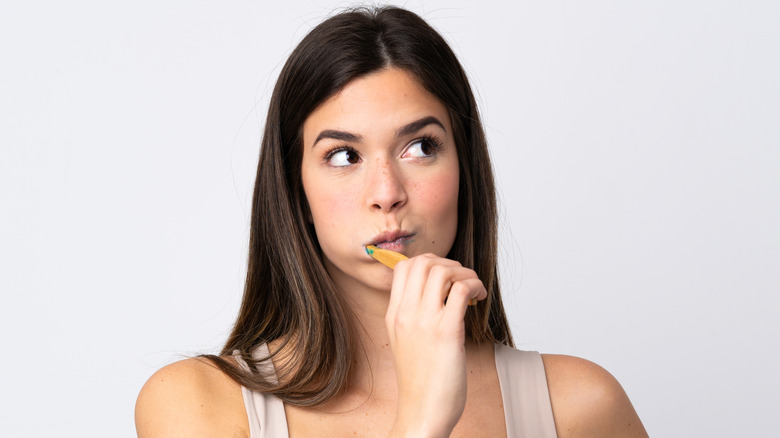 Woman brushing teeth