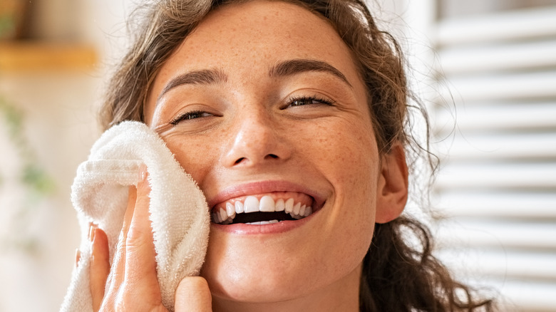 Woman wiping her face