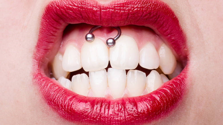 woman with smiley piercing snarling